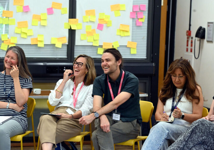 Attendees collaborating near a sticky-note planning wall at Watershed, Bristol
